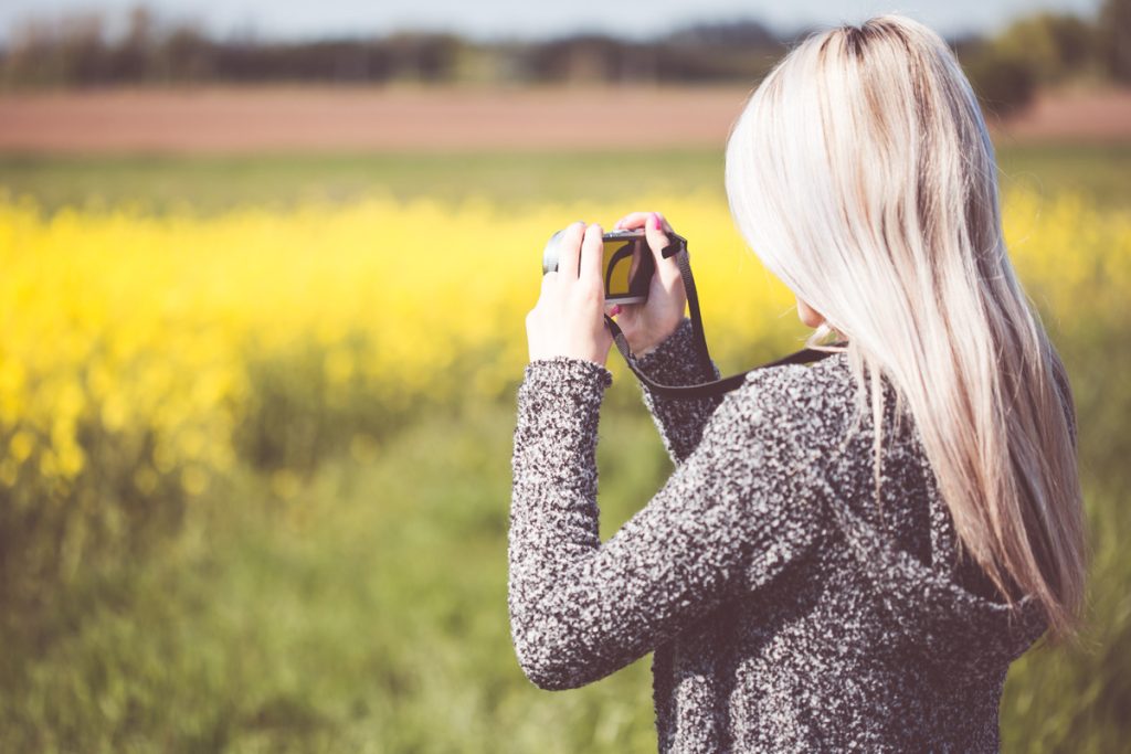 Girl Taking a Photo in Nature