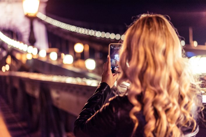 Blonde Woman Taking a Photo